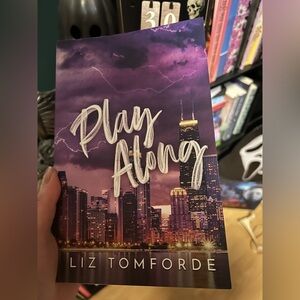 Play Along by Liz Tomforde - Purple City Skyline Paperback